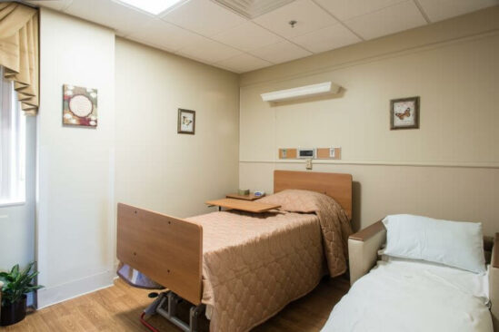 In-patient room with an extra bed
