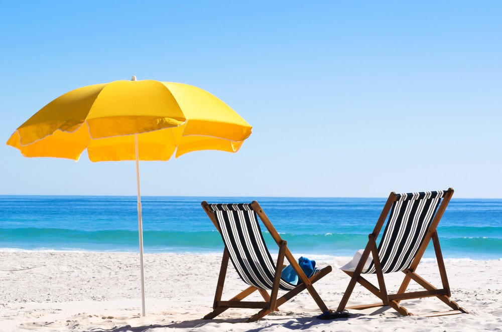 two beach chairs and a beach umbrella