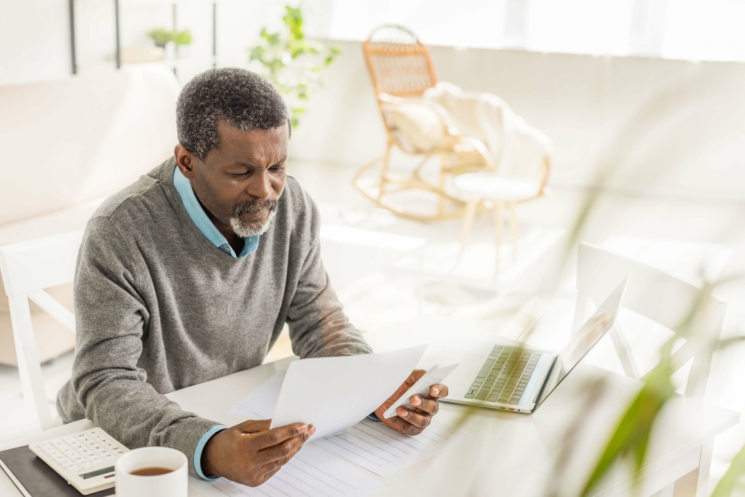 Older man reviewing documents