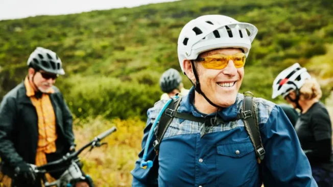 middle-aged adults mountain biking
